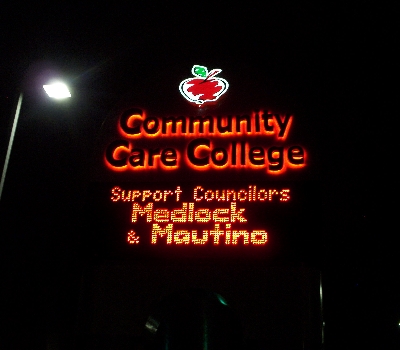 Community Care College sign reads: Support Councilors Medlock & Mautino