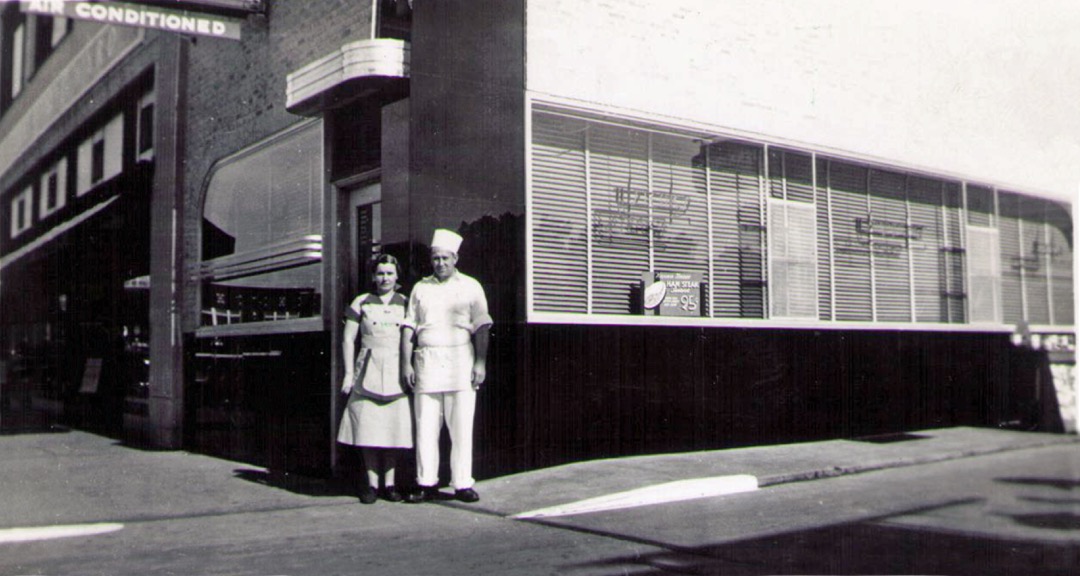 Raymond Elmer and his wife Sarah stand in front of Harris Lunch in downtown Ponca City, probably in the early 1940s. Photo supplied by Gary Hodges.