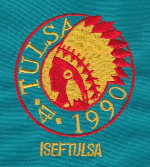 ISEF 1990 Tulsa embroidered Indian head logo on a teal windbreaker