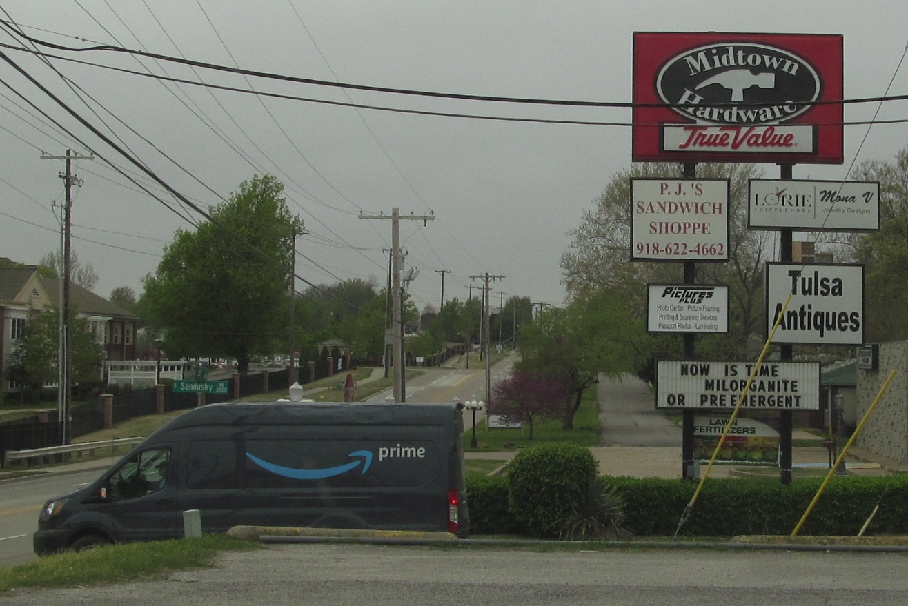 Amazon delivery truck drives past Tulsa-owned Midtown Hardware at 31st and Sandusky, on April 4, 2020.