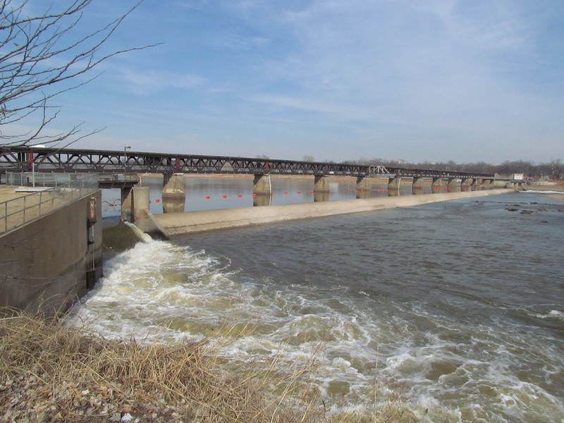 Tulsa's Midland Valley Pedestrian Bridge and Zink Lake Dam viewed from the west bank, south of the bridge and dam.