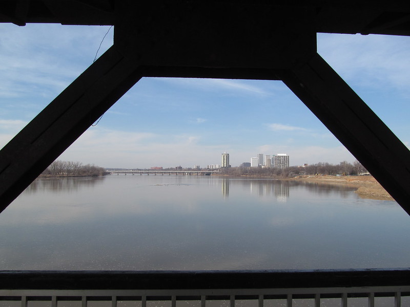 Midland Valley Pedestrian Bridge looking north along the Arkansas River toward the downtown Tulsa skyline.