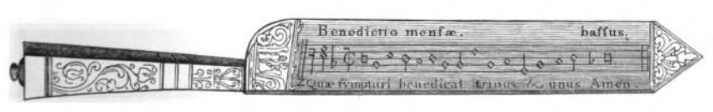 Engraved illustration of a notation knife, showing the bass part of the table blessing, Benedictio mensae, from Dresses and Decorations of the Middle Ages, by Henry Shaw, 1843