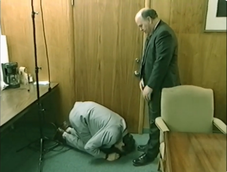 Borat prostrates himself before Oklahoma Republican Party chairman Gary Jones