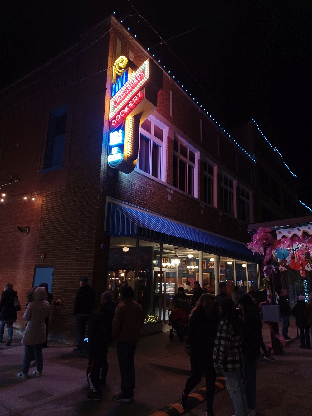 Neon sign of the newly-opened Crossroads Cookery at 117 E. Dewey Avenue, Sapulpa, during the inaugural 2022 Route 66 Christmas Chute.