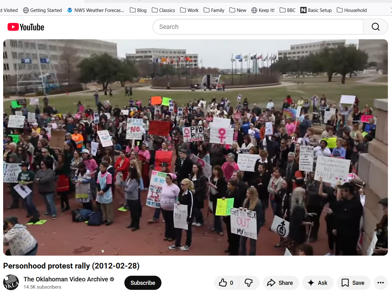 Colleen McCarty appears bottom center in a pink T-shirt at a February 28, 2012, pro-abortion rally at the Oklahoma State Capitol